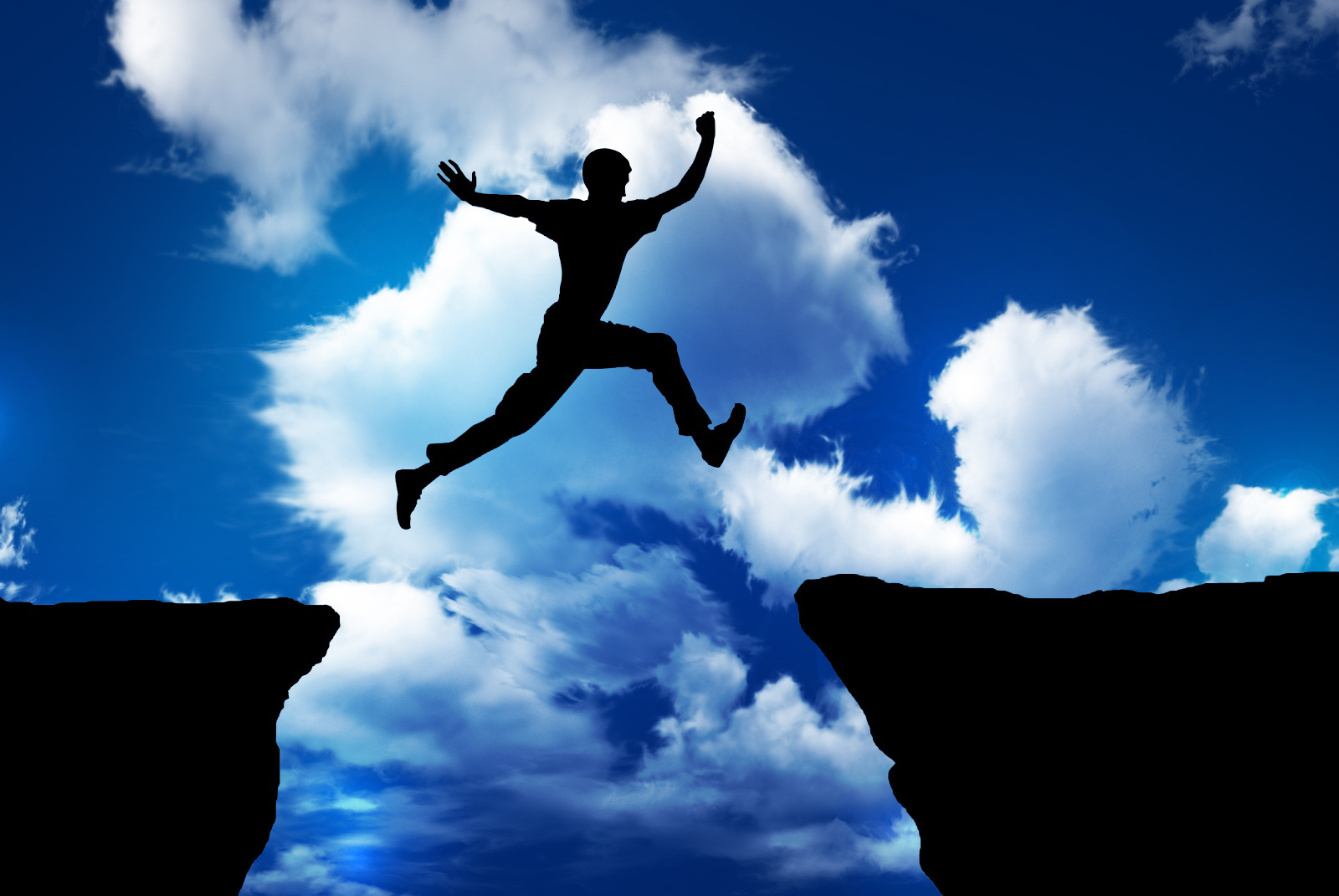 man confidently jumping between two cliff edges. Describes confidence with investment decisions, or over confidence